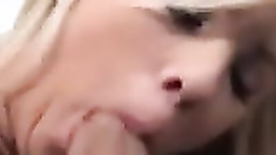 Close-up on a blonde doll while she's giving a hot blowjob