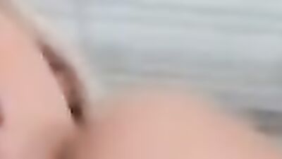 Close-up on a blonde doll while she's giving a hot blowjob