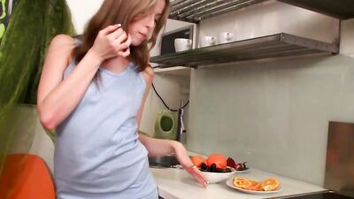 Young hottie teases in the kitchen and masturbates with sex toys
