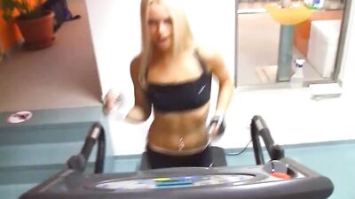 Slutty blonde babe in sports gear rubs her twat after the gym workout