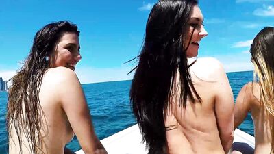 Beautiful babes sucking monster big dick out doors at the boat