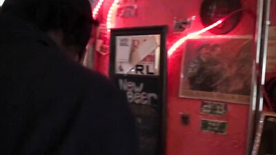 Gorgeous Latina having fun and interacting with men in the pub