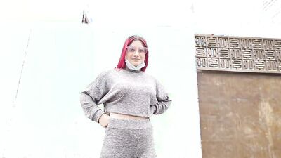 Foxy redhead with sexy glasses strokes a dick and sucks it