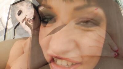 Naughty brunette flirts with the camera while sucking hard cocks