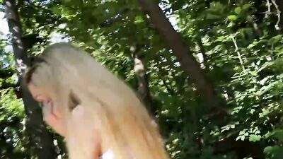 Juicy blonde flashes tits and pussy in the woods and sucks a cock