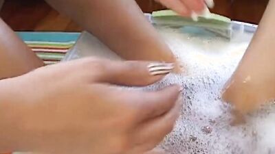 Two dirty lesbian girls are smearing chocolate and licking pussies