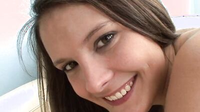 Dirty girl smiles at the camera with a dick in her mouth