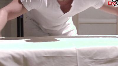 Blonde girl Carla Cox is rubbed with oil and fucked outside