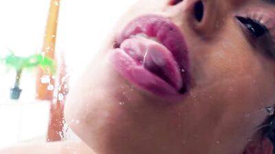 Splendid brunette Katrina spits and licks her saliva from a glass
