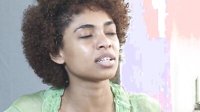 Tight Ebony with curly hair puts a dildo in her cherry