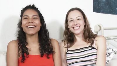 Tanned curly babe gets her pussy fingered by white brunette