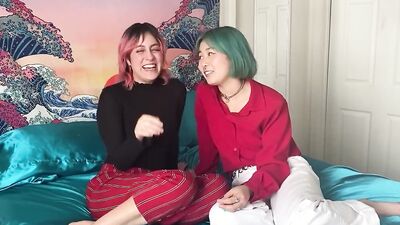 Two kinky lesbian nymphos are shoving a huge dildo in their pussies