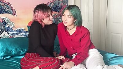 Two kinky lesbian nymphos are shoving a huge dildo in their pussies