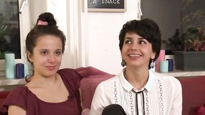 Cute teens are having hot lesbian action on the sofa