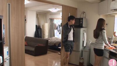 Asian couple is cuddling away from the crowd in a small house
