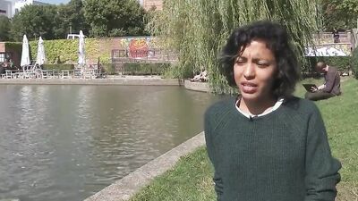 Remarkable Latina with curly hair is taking off her clothes and masturbating