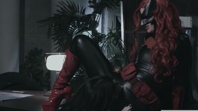 Charismatic lesbians are wearing superhero cosplays while licking each other