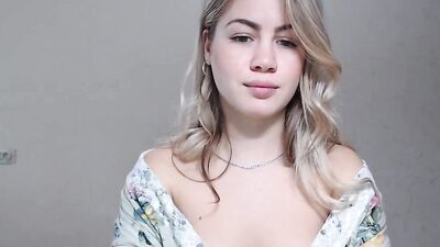 Lovely blonde girl teases with her nice booty on a live webcam show