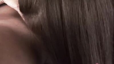 Chubby brunette lesbian with big pierced tits puts a strap on