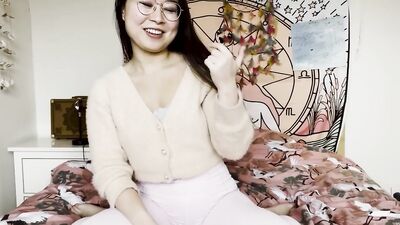 Nerdy Asian doll rubs her twat in front of the camera