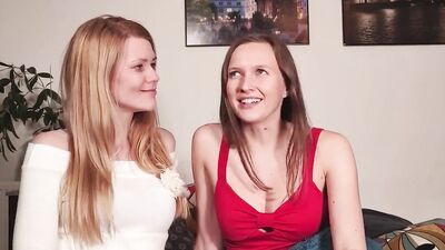 Two cute lesbian babes are playing with each other's cunt