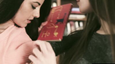 Two lovely lesbians are enjoying in some action inside the library