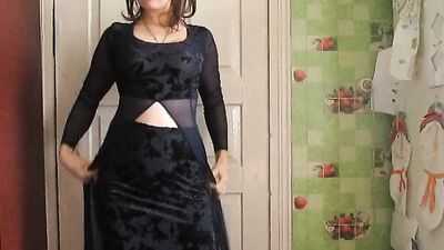 Amateur mature is getting dressed in front of the cam