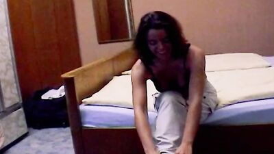 Dark haired German chick enjoys getting her boobs covered with cum