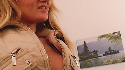A blonde German girl gets her round boobs covered with cum