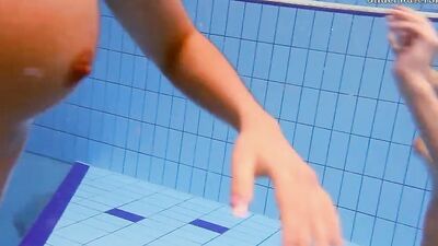 Fun naked girls get naughty in the pool
