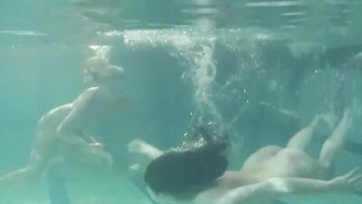 Russian lesbian girls swimming in the pool