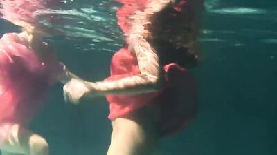 Russian lesbian girls swimming in the pool