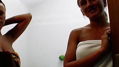 Two beautiful looking German chicks playing with a strapon