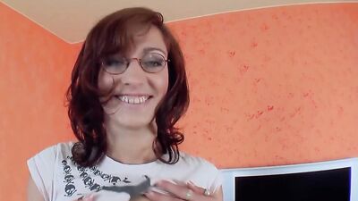A horny German chick loves stuffing a massive dong inside her