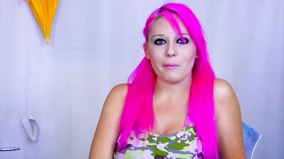 A busty pink haired babe from Germany gets her face sprayed with warm cum