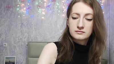 Brunette amateur with naked shoulders on webcam