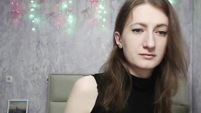Brunette amateur with naked shoulders on webcam