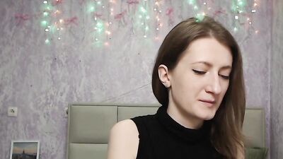 Brunette amateur with naked shoulders on webcam