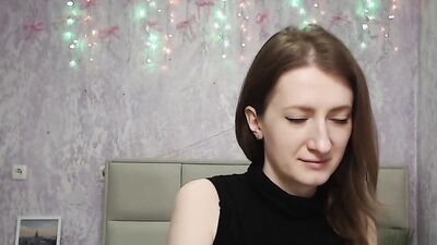 Brunette amateur with naked shoulders on webcam