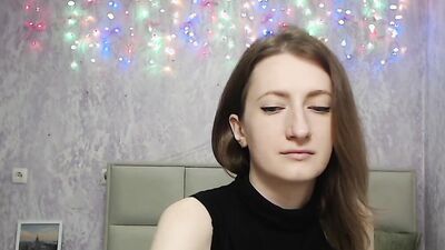 Brunette amateur with naked shoulders on webcam