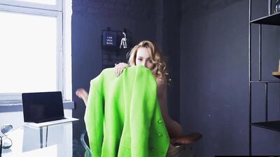 Watch this sexy blonde businesswoman masturbate at her desk