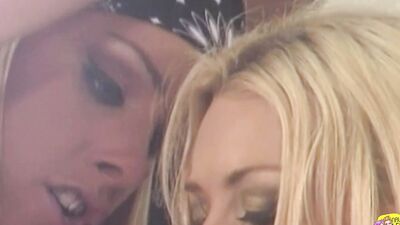 Biker chick fingers herself before being joined by a blonde who gives her an orgasm