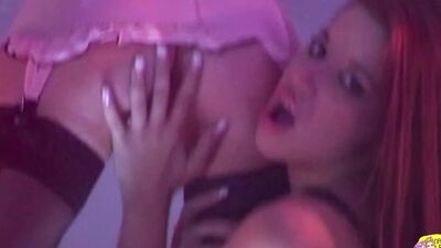 Two kinky lesbians give a special striptease show where they use a strap-on to fuck