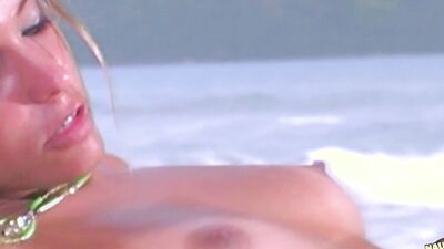On a paradise island this fit babe in a bikini gets a hot facial