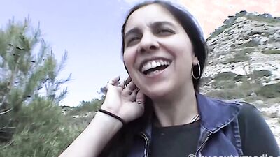Naked woman masturbates outdoors