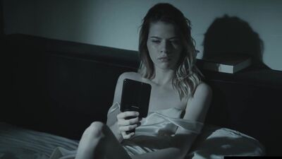 Cute girl studies her pussy in the mirror as she masturbates