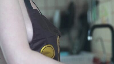 Cinematic film in which the husband films his wife undressed in the kitchen, behind the scenes