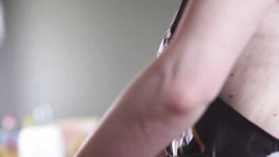 Cinematic film in which the husband films his wife undressed in the kitchen, behind the scenes