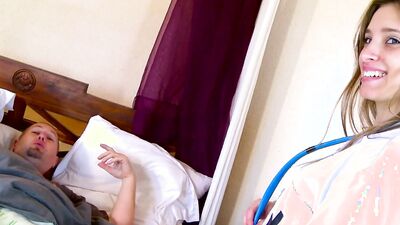 Nurse in white stockings takes care of her patients cock