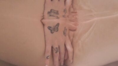 Hot babe touching herself and rubbing her pink pussy in the bathtub